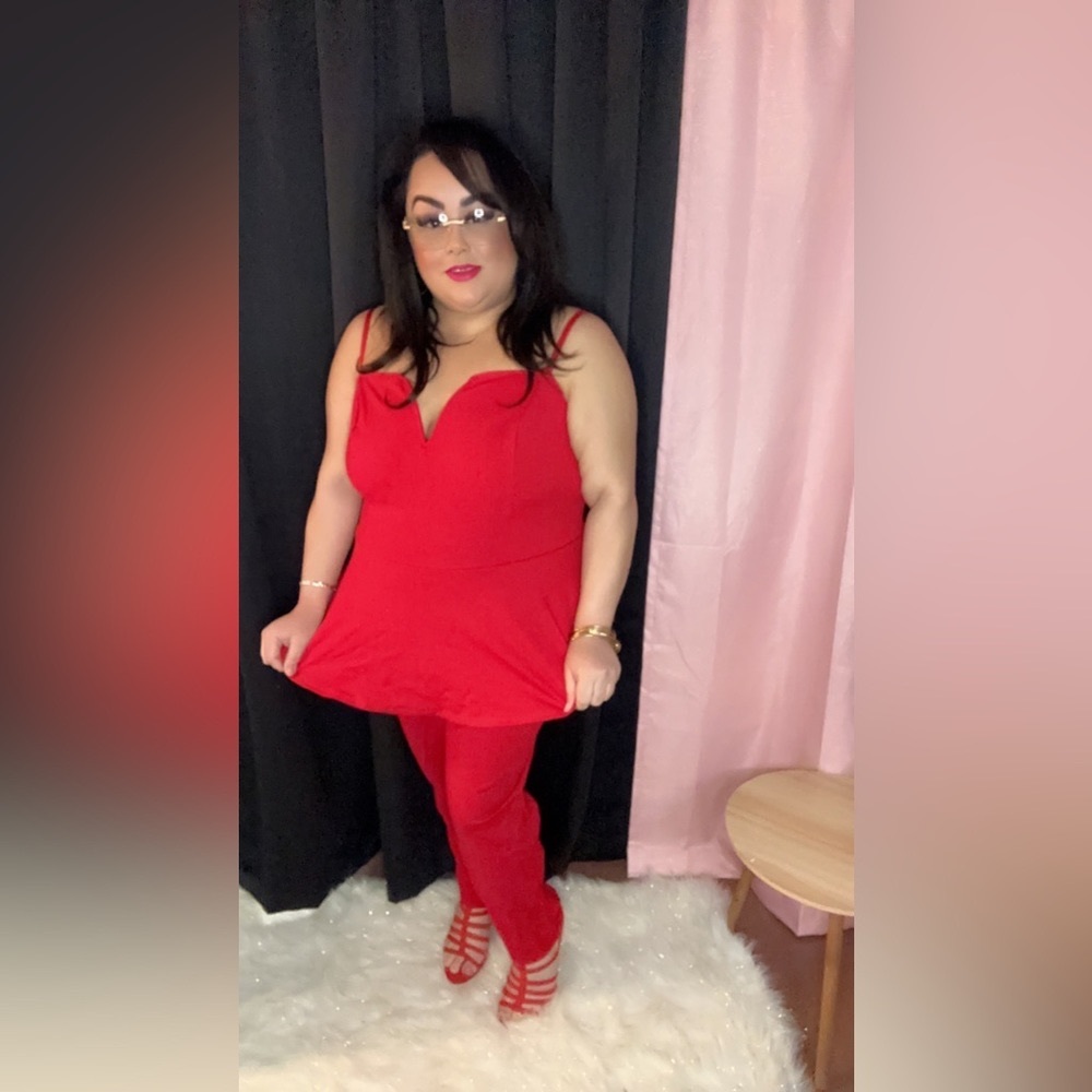 Red, jumpsuit that is peplum style.